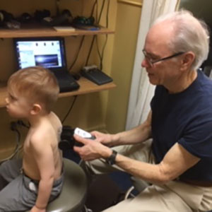 Doctor scanning child