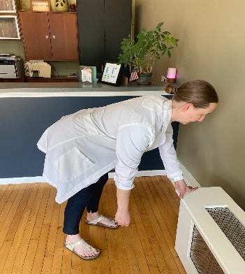 chiropractor demonstrating shoulder excercise 2
