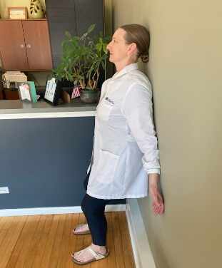 chiropractor demonstrating shoulder excercise 6