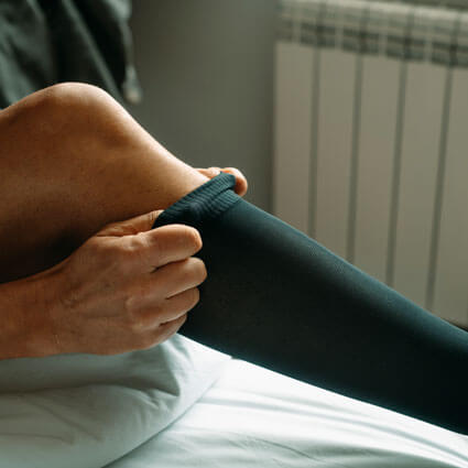 Putting on compression socks