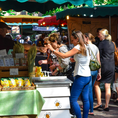 people shopping at farmers market