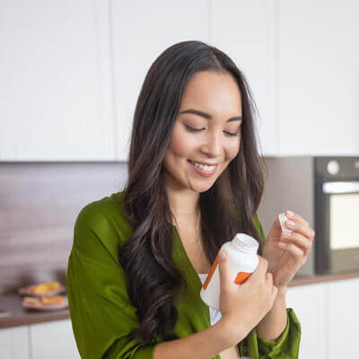 Woman looking at supplements