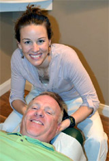 Dr. Quinlan with a patient Dr. Quinlan with a patient