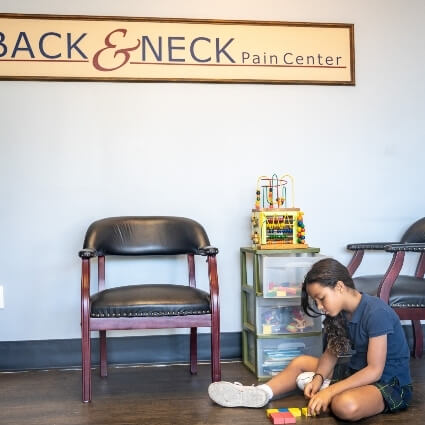 child patient sitting in our waiting area