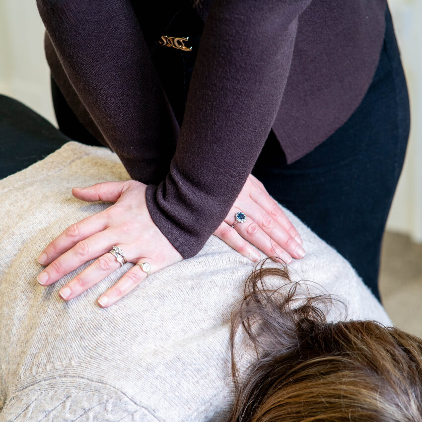 patient having back adjusted