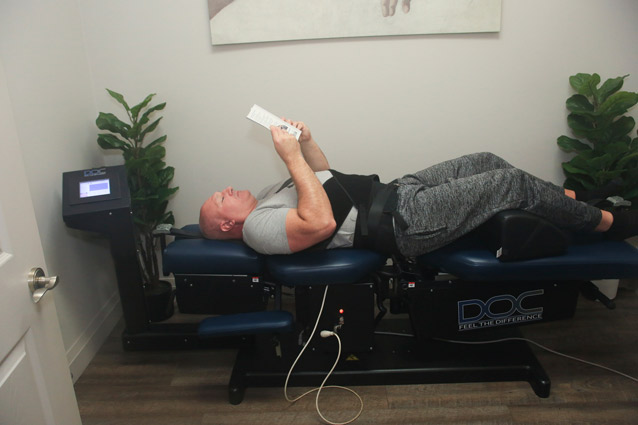 man on spinal decompression table