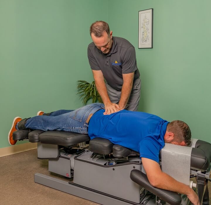 Livonia chiropractor Dr. Kyle adjusting patient