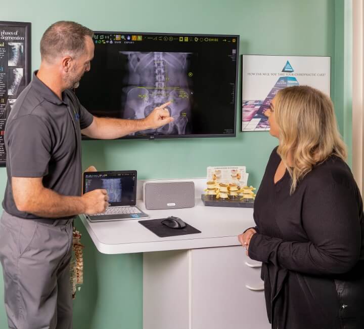 Livonia chiropractor Dr. Kyle reviewing X-Ray