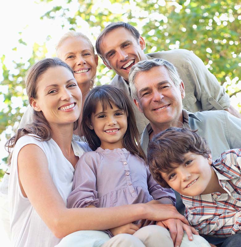 multigenerational family smiling outside