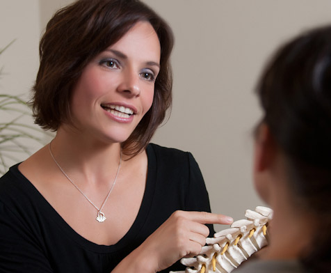 South Portland Chiropractor speaking with patient