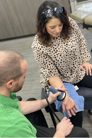 woman getting shockwave therapy