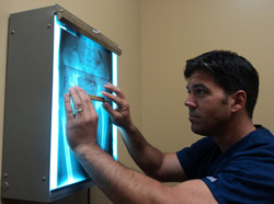 Dr. Anthony Silecchio reading x-rays.