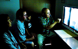 Dr. Edward Richardson reviewing x-ray with a patient. Dr. Edward Richardson, Las Cruces Chiropractor with patients