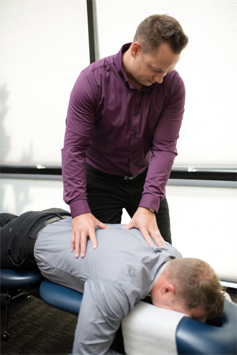 doc adjusting a patient 