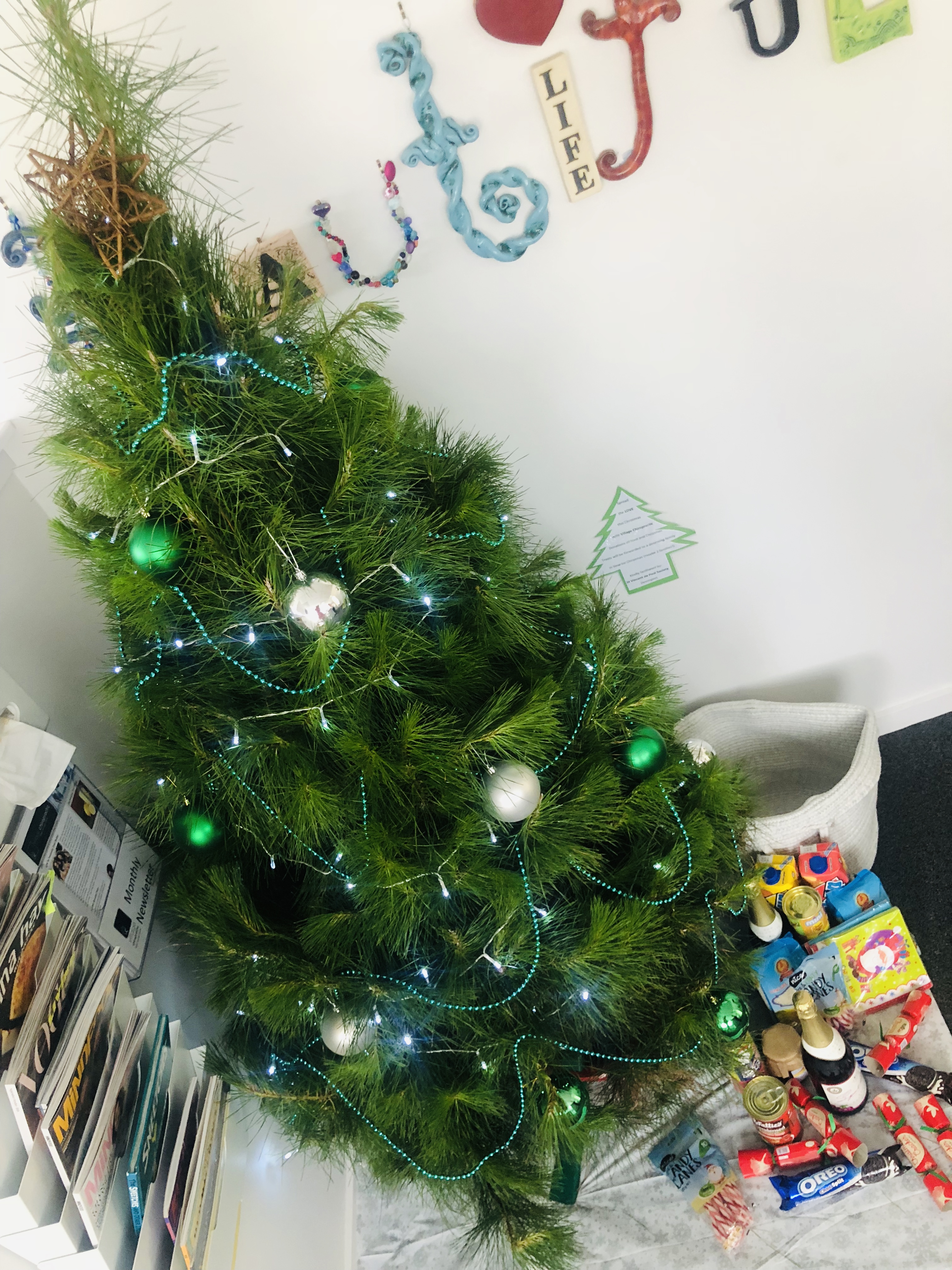 Christmas Tree in the office with the hamper donations.