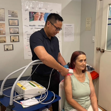 Doctor doing laser therapy on patient