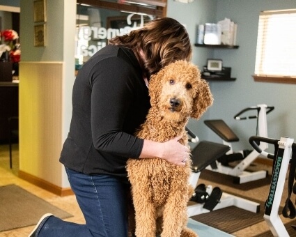 Chiropractor adjusting a dog