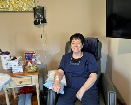 Female staff receiving IV therapy