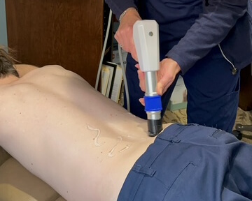 Wave Therapy device used on knee