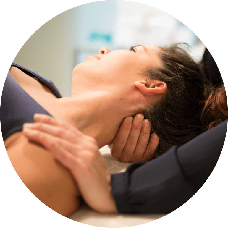 chiropractor adjusting persons neck 