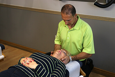 Dr. Weyrauch giving chiropractic adjustment