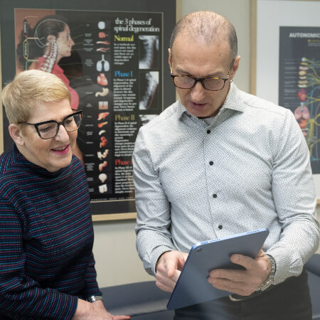 North York chiropractor discussing results with patient