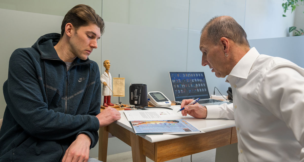 Doctor reviewing form with patient