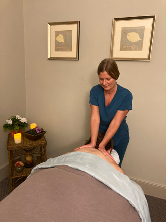 Massage therapist Amy during patient massage
