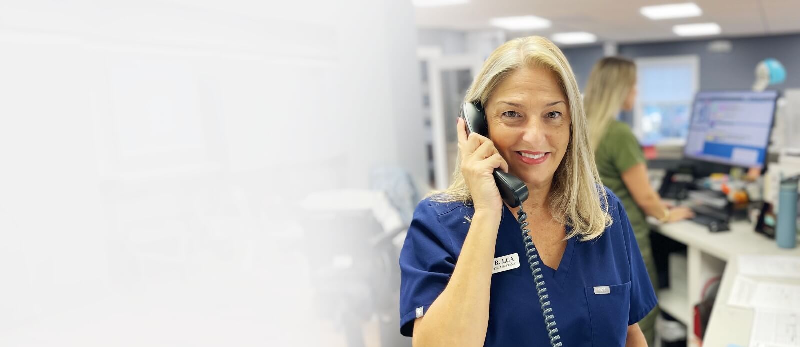 receptionist on a phone call