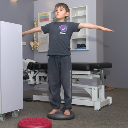 Young boy balancing