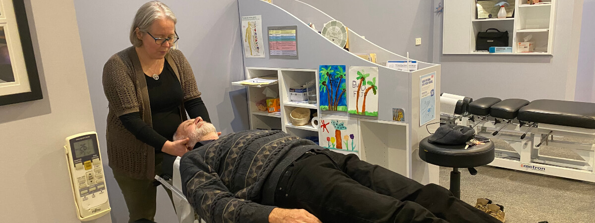 Canberra patient treated with a chiropractic neck adjustment