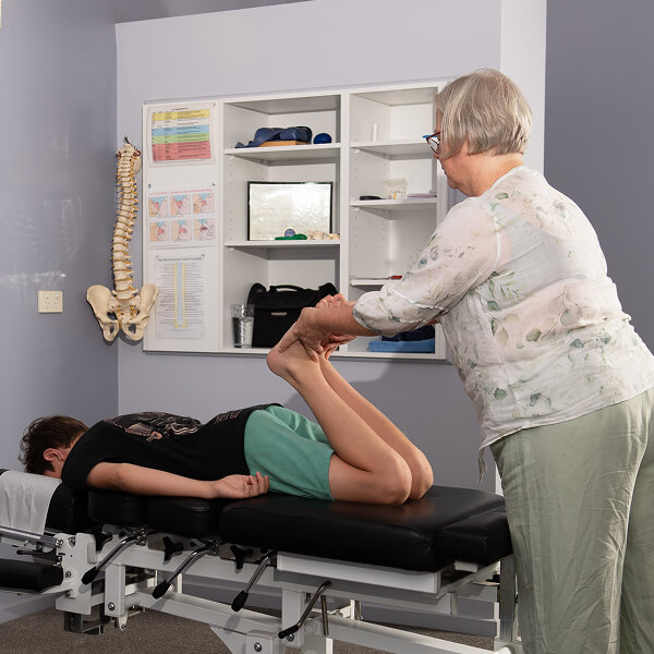 Dr. Kathy adjusting patient