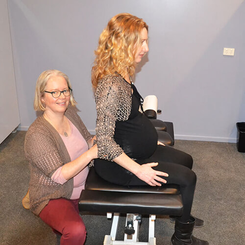Canberra chiropractor assessing a pregnant woman