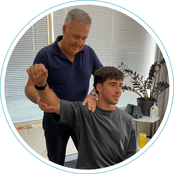 Chiropractor adjusting shoulder
