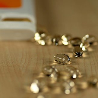 liquid vitamin capsules on a tabletop