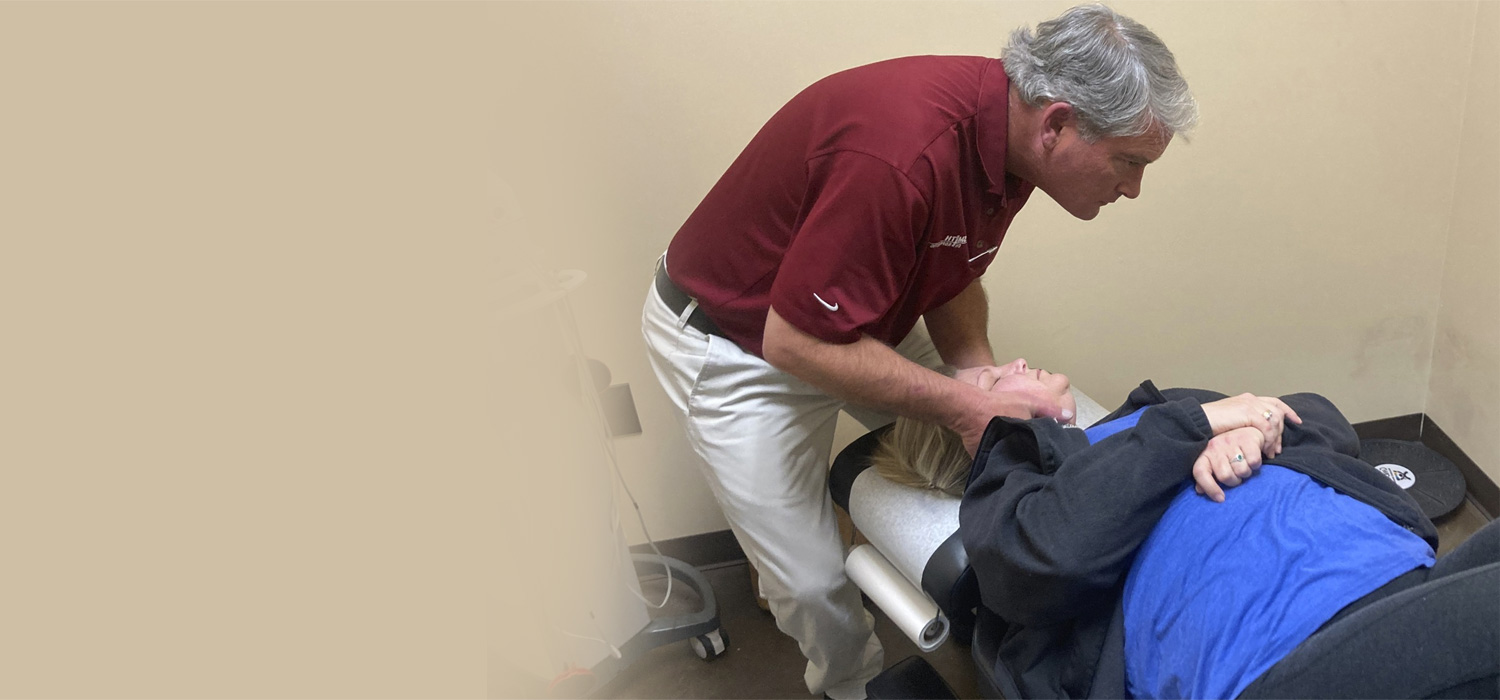 Dr. Smith adjusting patients neck