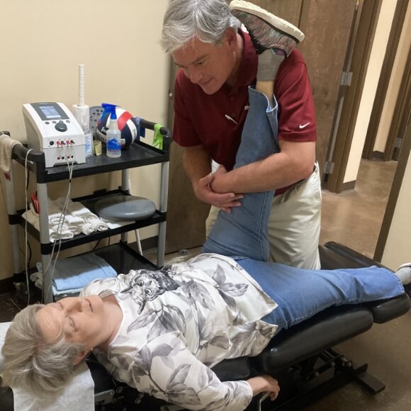 Dr. Ben adjusting patient