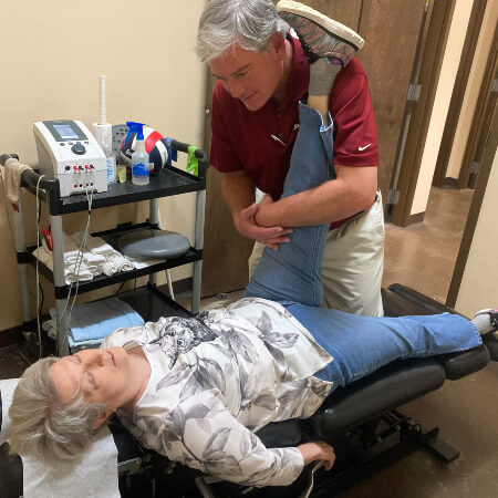Chiropractor performing Active Release Technique on a patient in Hoover