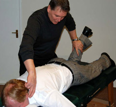Dr. White (D.C.) adjusts a patient.