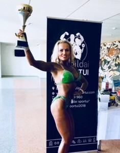 Monika Kelly holding trophy