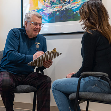 Dr Handly talking to a patient