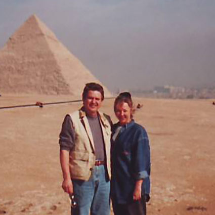 Dr Rod and Linda standing in front of the great pyramids