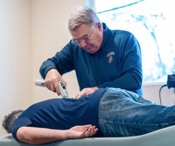 Dr. Rod adjusting patient