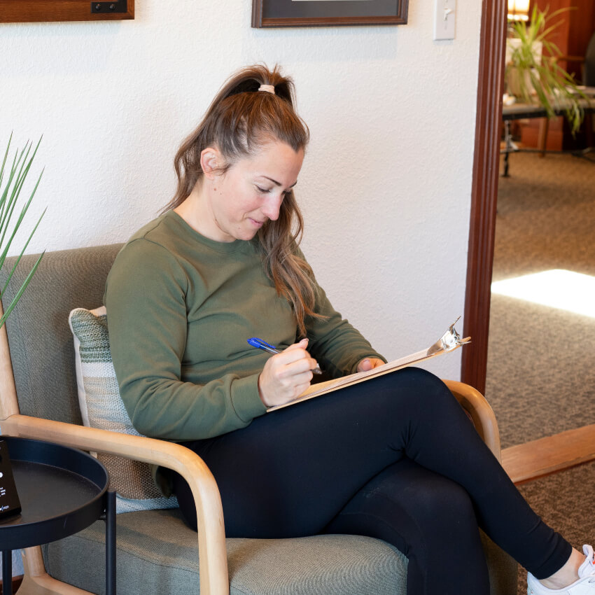 woman filling out paperwork