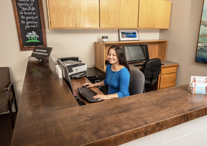 Receptionist at desk