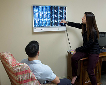 Dr. Sara reviewing an MRI with a patient