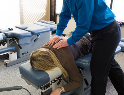 Dr. Jesse giving upper back adjustment