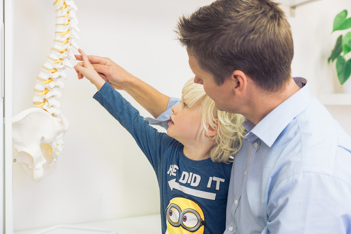 Chiropractor Dr Luke Tassell with Child