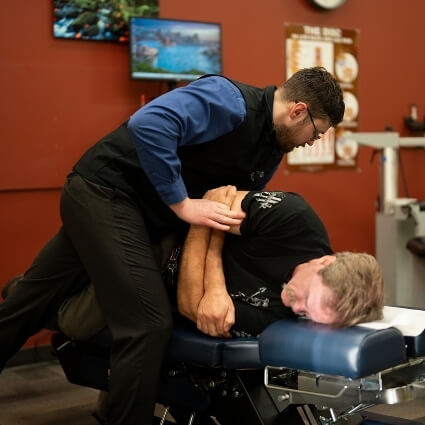 Man receiving shoulder pain treatment