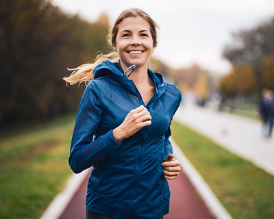woman smiling while jogging